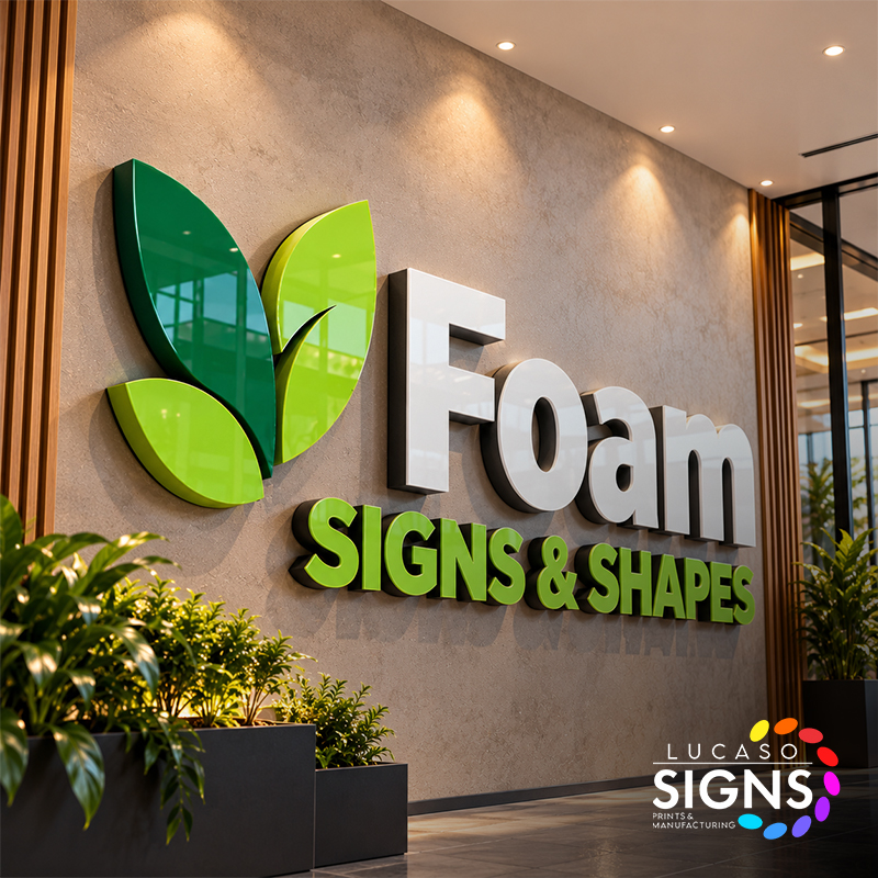 Custom dimensional foam letters and decorative foam shapes with green and white finishes installed on an interior business wall