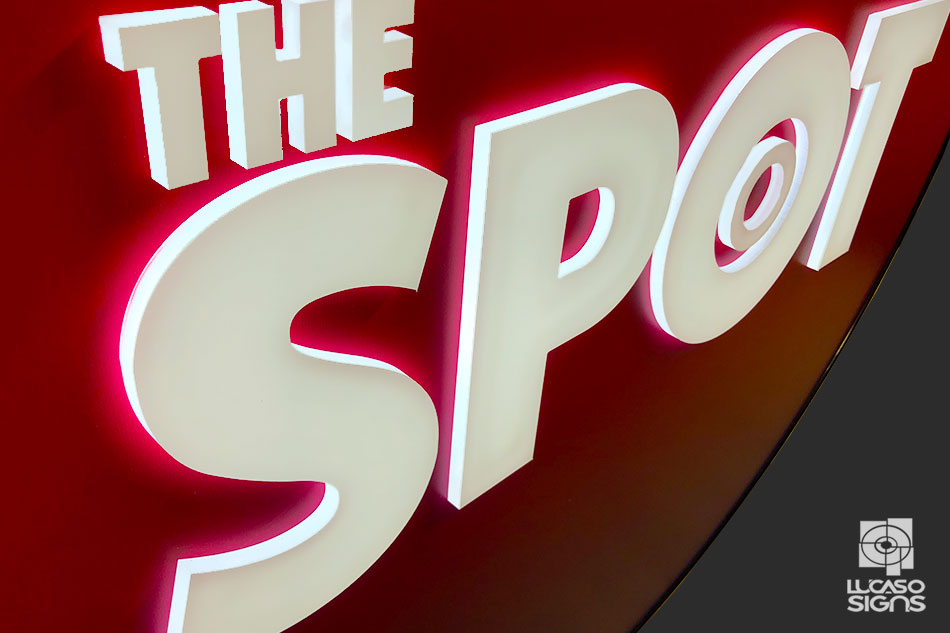 Push Through white acrylic on red background by Lucaso Signs