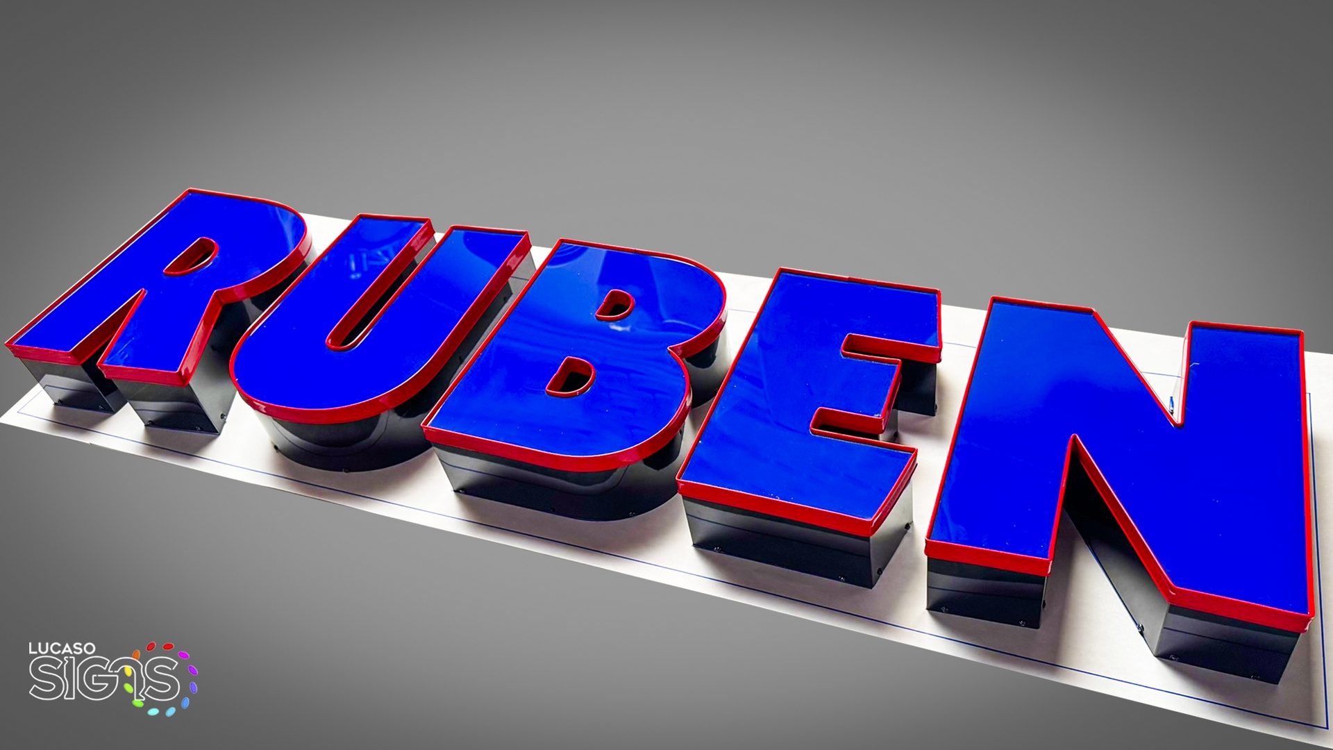 Blue channel letters with red trimcap and black return by lucaso signs